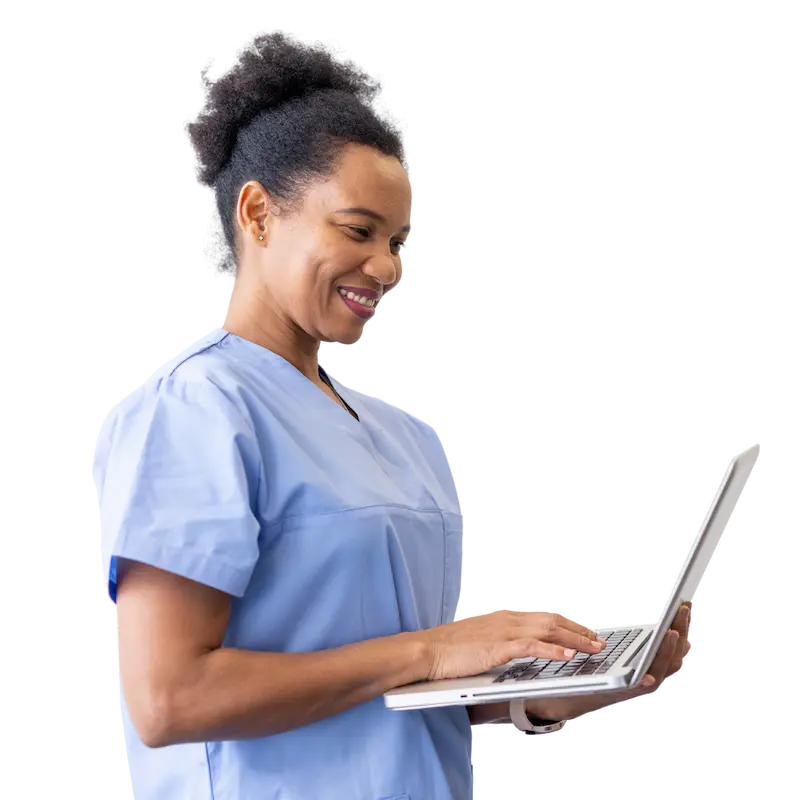 Smiling medical professional working on a laptop