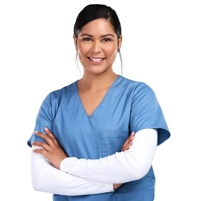 a woman in blue scrubs with her arms crossed